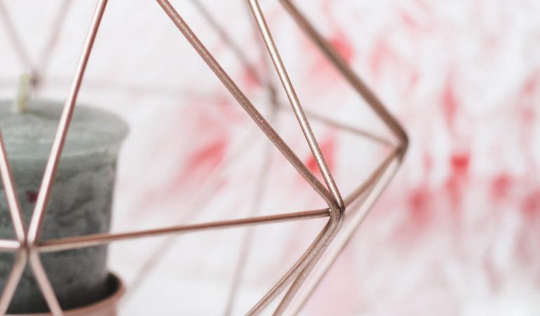 selective-focus-photography-of-candle-in-pink-ornate-holder